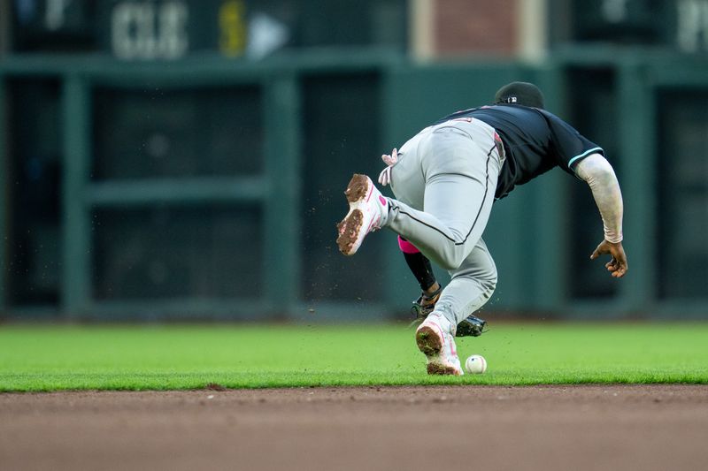 May 12, 2025; San Francisco, California, USA;Arizona Diamondbacks second baseman Ketel Marte (4)  cannot field the ball hit by San Francisco Giants left fielder Heliot Ramos (not pictured) during the fourth inning at Oracle Park. Mandatory Credit: Neville E. Guard-Imagn Images