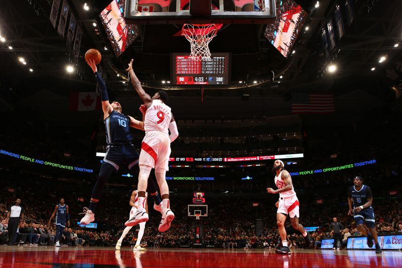 TORONTO, CANADA - JANUARY 22: Luke Kennard #10 of the Memphis Grizzlies drives to the basket during the game against the Toronto Raptors on January 22, 2024 at the Scotiabank Arena in Toronto, Ontario, Canada.  NOTE TO USER: User expressly acknowledges and agrees that, by downloading and or using this Photograph, user is consenting to the terms and conditions of the Getty Images License Agreement.  Mandatory Copyright Notice: Copyright 2024 NBAE (Photo by Vaughn Ridley/NBAE via Getty Images)