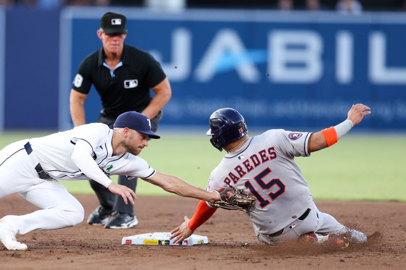 May 19, 2025; Tampa, Florida, USA; Houston Astros third baseman Isaac Paredes (15) is caught stealing by Tampa Bay Rays second baseman Brandon Lowe (8) in the third inning at George M. Steinbrenner Field. Mandatory Credit: Nathan Ray Seebeck-Imagn Images