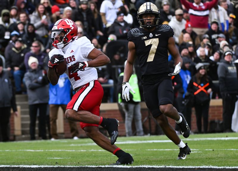 Nov 25, 2023; West Lafayette, Indiana, USA; Indiana Hoosiers wide receiver DeQuece Carter (4) runs a catch in for a touchdown during the first half at Ross-Ade Stadium. Mandatory Credit: Robert Goddin-USA TODAY Sports