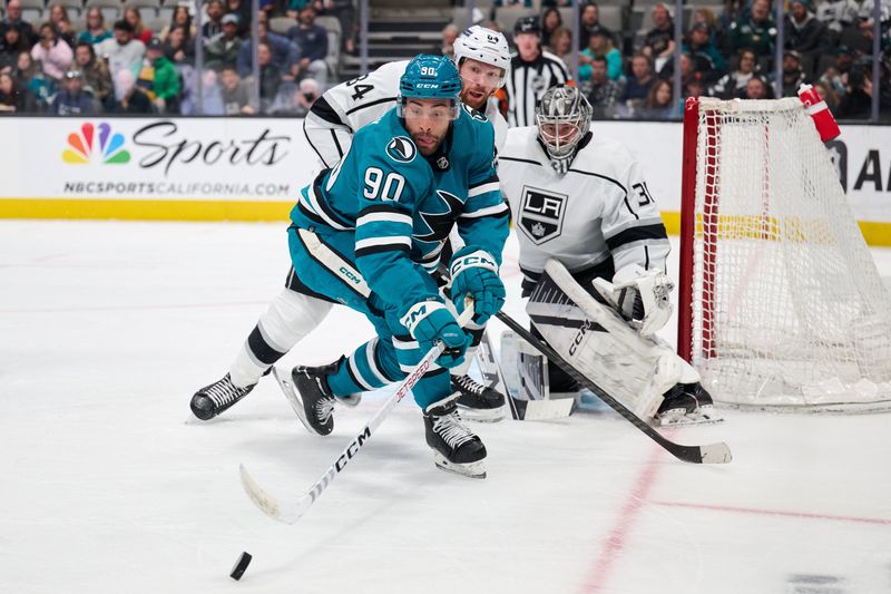 Apr 4, 2024; San Jose, California, USA; San Jose Sharks right wing Justin Bailey (90) plays the puck against Los Angeles Kings defenseman Vladislav Gavrikov (84) and goaltender David Rittich (31) during the second period at SAP Center at San Jose. Mandatory Credit: Robert Edwards-USA TODAY Sports