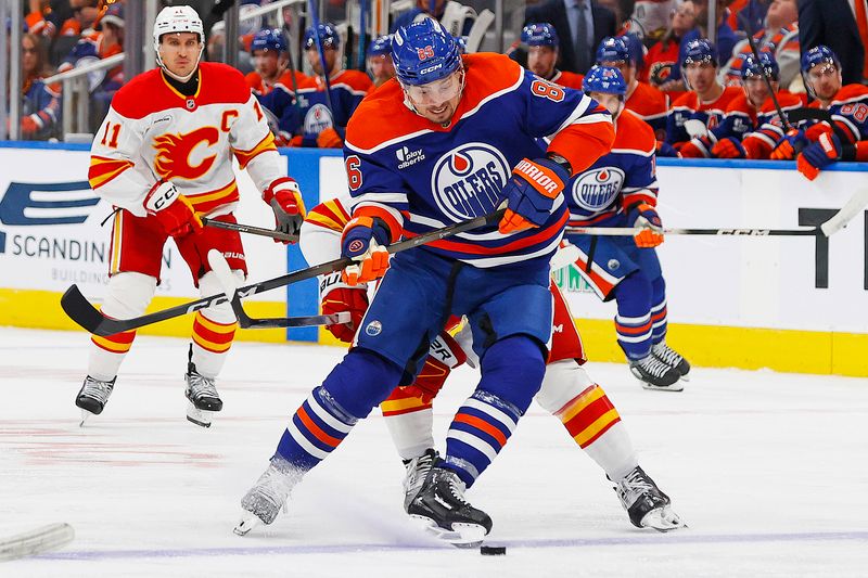 Oct 8, 2025; Edmonton, Alberta, CAN;  Edmonton Oilers forward David Tomasek (86) protects the puck from from Calgary Flames forward Connor Zary (47) during the third period at Rogers Place. Mandatory Credit: Perry Nelson-Imagn Images