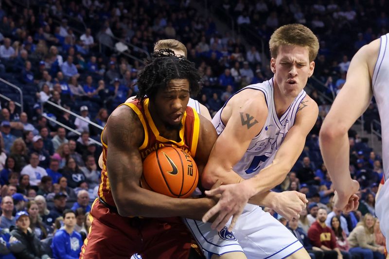 Jan 16, 2024; Provo, Utah, USA; Iowa State Cyclones forward Tre King (0) and Brigham Young Cougars forward Noah Waterman (0) battle for a rebound during the second half at Marriott Center. Mandatory Credit: Rob Gray-USA TODAY Sports