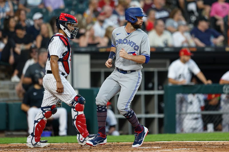 Jul 4, 2023; Chicago, Illinois, USA; Toronto Blue Jays designated hitter Brandon Belt (13) scores against the Chicago White Sox during the fourth inning at Guaranteed Rate Field. Mandatory Credit: Kamil Krzaczynski-USA TODAY Sports