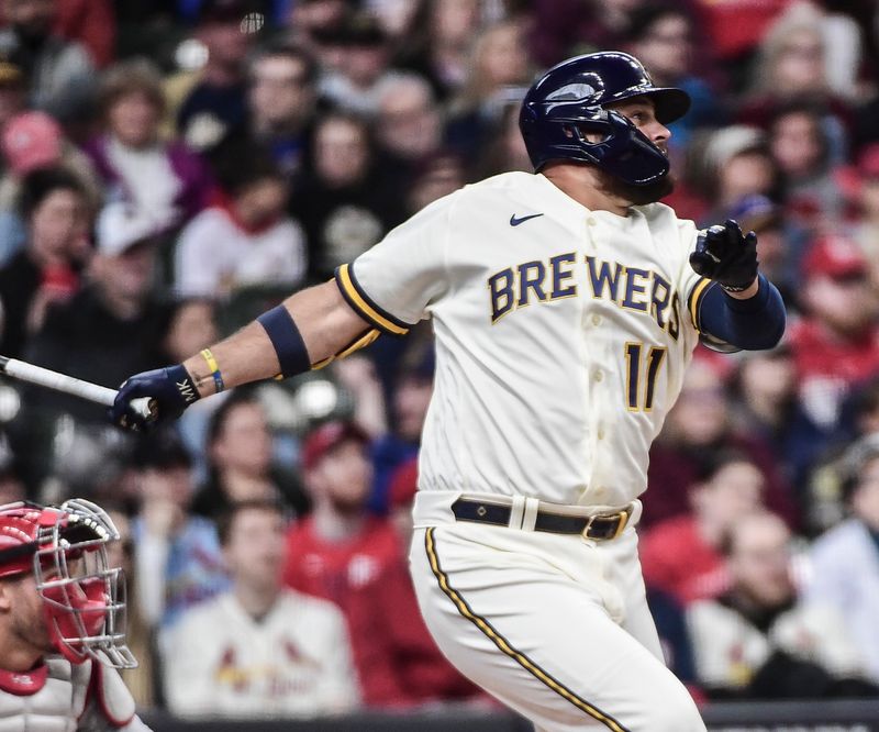 Apr 17, 2022; Milwaukee, Wisconsin, USA; Milwaukee Brewers first baseman Rowdy Tellez (11) hits a double to drive in a run in the first inning during game against the St. Louis Cardinals at American Family Field. Mandatory Credit: Benny Sieu-USA TODAY Sports