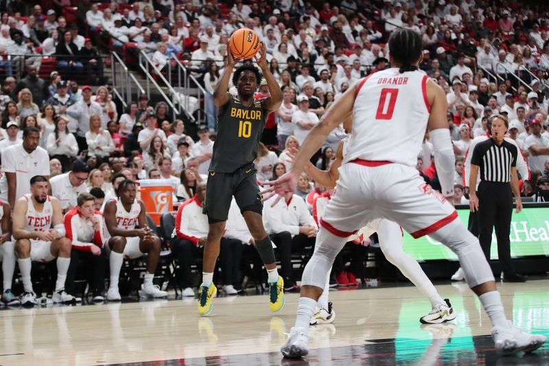 Jan 17, 2023; Lubbock, Texas, USA;  Baylor Bears guard Adam Flagler (10) takes a shot against Texas Tech Red Raiders guard Jalen Tyson (20) and forward Kevin Obanor (0) in the first half at United Supermarkets Arena. Mandatory Credit: Michael C. Johnson-USA TODAY Sports