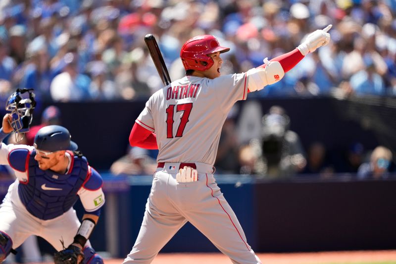 Jul 30, 2023; Toronto, Ontario, CAN; Los Angeles Angels designated hitter Shohei Ohtani (17) gestures to second baseman Luis Rengifo (not pictured) to run to second base on a passed ball by the Toronto Blue Jays during the ninth inning at Rogers Centre. Mandatory Credit: John E. Sokolowski-USA TODAY Sports