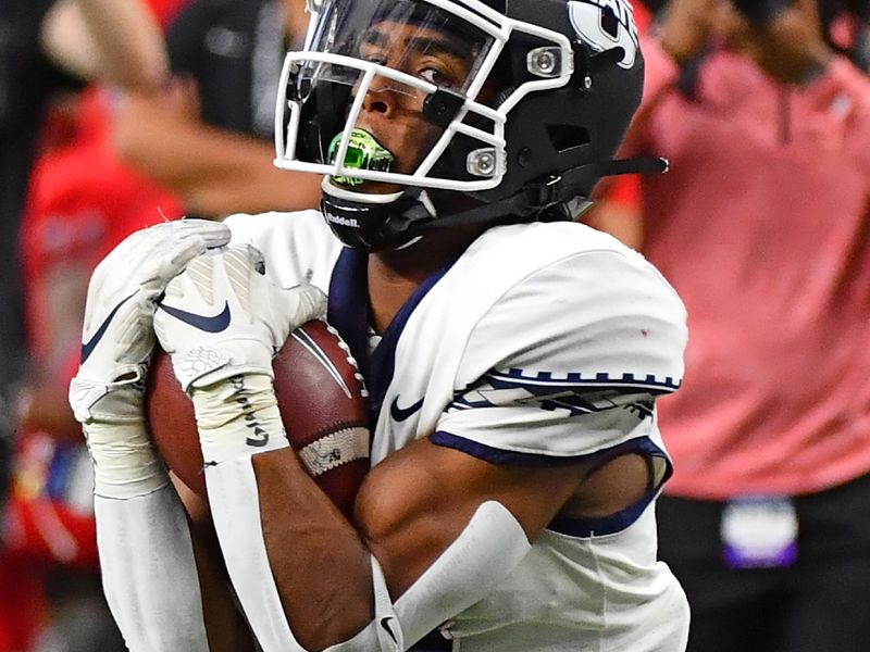 Oct 16, 2021; Paradise, Nevada, USA;  Utah State Aggies wide receiver Deven Thompkins (13) eyes the end zone after making a 37-yard reception against the UNLV Rebels at Allegiant Stadium. Mandatory Credit: Stephen R. Sylvanie-USA TODAY Sports