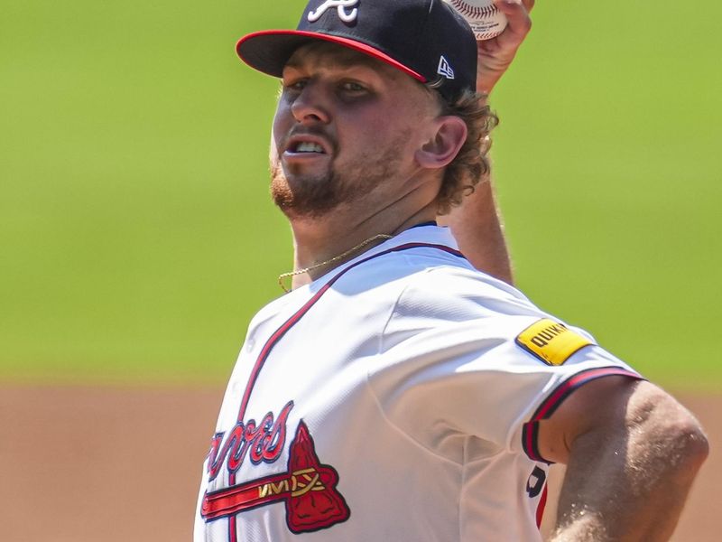 Jun 30, 2024; Cumberland, Georgia, USA; Atlanta Braves starting pitcher Spencer Schwellenbach (56) pitches against the Pittsburgh Pirates during the first inning at Truist Park. Mandatory Credit: Dale Zanine-USA TODAY Sports