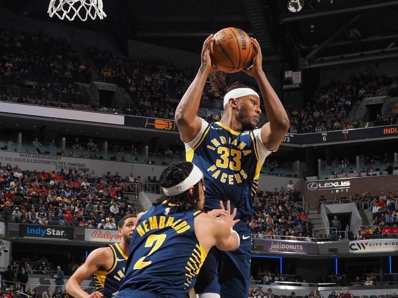 INDIANAPOLIS, IN - MARCH 13:  Myles Turner #33 of the Indiana Pacers grabs the rebound during the game on March 13, 2024 at Gainbridge Fieldhouse in Indianapolis, Indiana. NOTE TO USER: User expressly acknowledges and agrees that, by downloading and or using this Photograph, user is consenting to the terms and conditions of the Getty Images License Agreement. Mandatory Copyright Notice: Copyright 2024 NBAE (Photo by Ron Hoskins/NBAE via Getty Images)