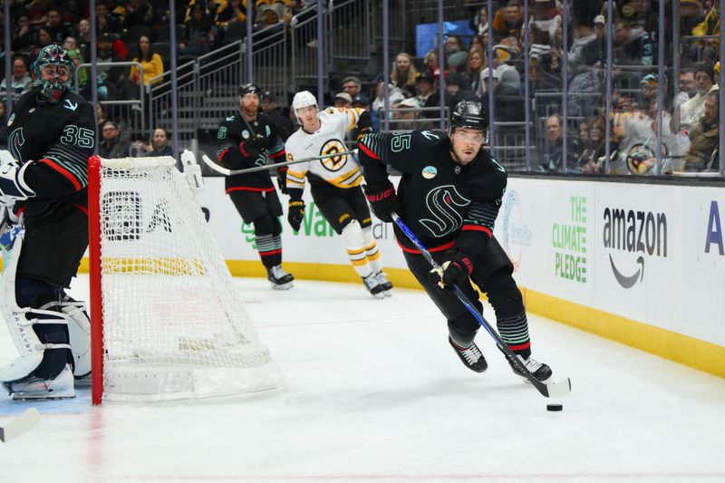 Jan 6, 2026; Seattle, Washington, USA; Seattle Kraken defenseman Ryan Lindgren (55) plays the puck during the third period against the Boston Bruins at Climate Pledge Arena. Mandatory Credit: Steven Bisig-Imagn Images