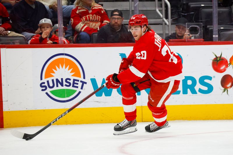 Nov 2, 2024; Detroit, Michigan, USA; Detroit Red Wings defenseman Albert Johansson (20) handles the puck during the first period of the game against the Buffalo Sabres at Little Caesars Arena. Mandatory Credit: Brian Bradshaw Sevald-Imagn Images