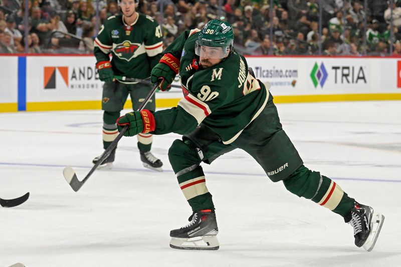 Sep 29, 2024; Saint Paul, Minnesota, USA;  Minnesota Wild forward Marcus Johansson (90) takes a shot on goal against the Dallas Stars during the second period at Xcel Energy Center. Mandatory Credit: Nick Wosika-Imagn Images