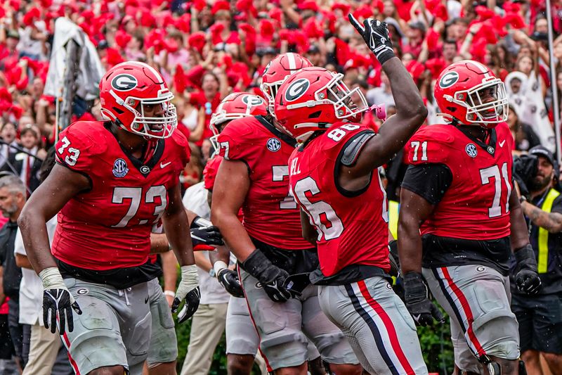 Sep 16, 2023; Athens, Georgia, USA; Georgia Bulldogs wide receiver Dillon Bell (86) reacts with teammates after scoring a touchdown against the South Carolina Gamecocks during the second half at Sanford Stadium. Mandatory Credit: Dale Zanine-USA TODAY Sports