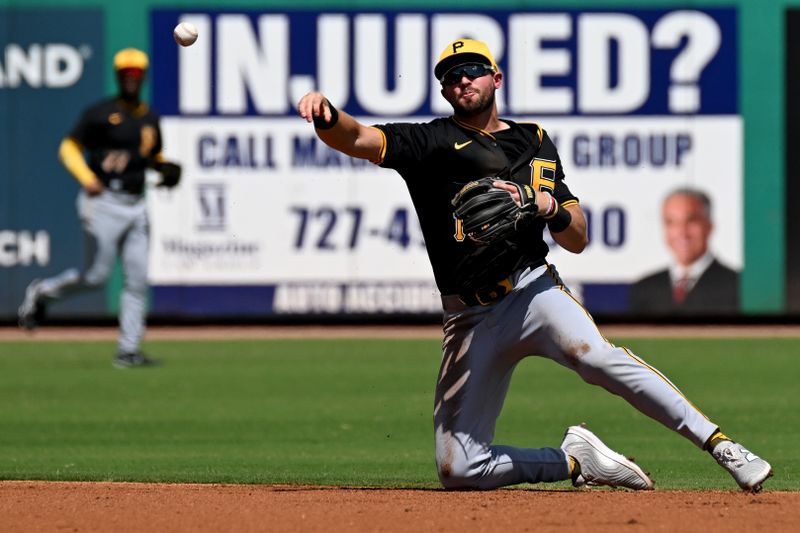 Mar 18, 2024; Clearwater, Florida, USA; Pittsburgh Pirates second baseman Jared Triolo (19) throws to first base in the first inning of the spring training game against the Philadelphia Phillies at BayCare Ballpark. Mandatory Credit: Jonathan Dyer-USA TODAY Sports