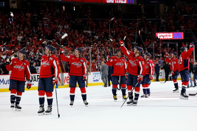 Apr 30, 2025; Washington, District of Columbia, USA; Washington Capitals players salute the fans after their game against the Montreal Canadiens in game five of the first round of the 2025 Stanley Cup Playoffs at Capital One Arena. Mandatory Credit: Geoff Burke-Imagn Images