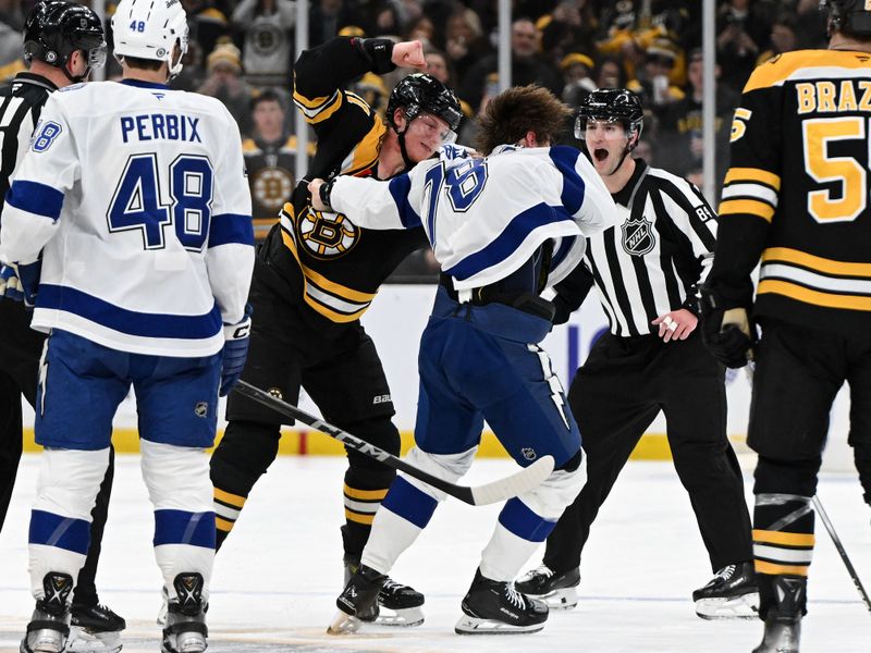 Jan 14, 2025; Boston, Massachusetts, USA; Boston Bruins center Trent Frederic (11) and Tampa Bay Lightning defenseman Emil Lilleberg (78) fight during the second period at the TD Garden. Mandatory Credit: Brian Fluharty-Imagn Images