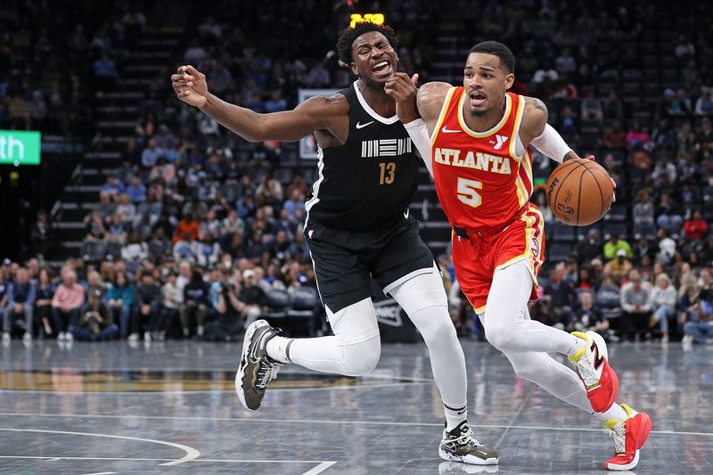 MEMPHIS, TENNESSEE - MARCH 08: Dejounte Murray #5 of the Atlanta Hawks goes to the basket against Jaren Jackson Jr. #13 of the Memphis Grizzlies during the first half at FedExForum on March 08, 2024 in Memphis, Tennessee. NOTE TO USER: User expressly acknowledges and agrees that, by downloading and or using this photograph, User is consenting to the terms and conditions of the Getty Images License Agreement. (Photo by Justin Ford/Getty Images)