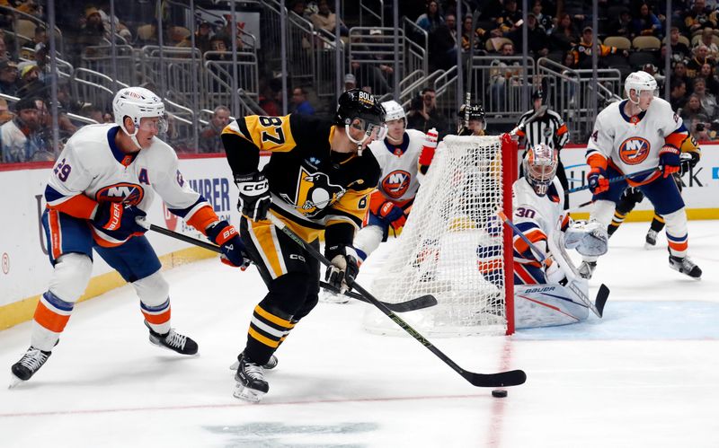 Feb 20, 2024; Pittsburgh, Pennsylvania, USA; New York Islanders center Brock Nelson (29) and New York Islanders goaltender Ilya Sorokin (30) defend Pittsburgh Penguins center Sidney Crosby (87) during the third period at PPG Paints Arena. New York won 5-4 in overtime. Mandatory Credit: Charles LeClaire-USA TODAY Sports