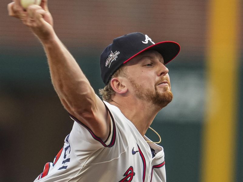 May 13, 2025; Cumberland, Georgia, USA; Atlanta Braves starting pitcher Spencer Schwellenbach (56) pitches against the Washington Nationals during the first inning at Truist Park. Mandatory Credit: Dale Zanine-Imagn Images
