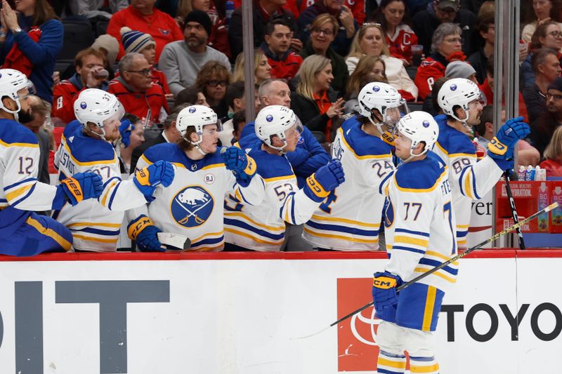 Nov 22, 2023; Washington, District of Columbia, USA; Buffalo Sabres right wing JJ Peterka (77) celebrates with teammates after scoring a goal against the Washington Capitals in the first period at Capital One Arena. Mandatory Credit: Geoff Burke-USA TODAY Sports