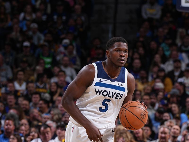 DENVER, CO - APRIL 10: Anthony Edwards #5 of the Minnesota Timberwolves dribbles the ball during the game against the Denver Nuggets on April 10, 2024 at the Ball Arena in Denver, Colorado. NOTE TO USER: User expressly acknowledges and agrees that, by downloading and/or using this Photograph, user is consenting to the terms and conditions of the Getty Images License Agreement. Mandatory Copyright Notice: Copyright 2024 NBAE (Photo by Garrett Ellwood/NBAE via Getty Images)