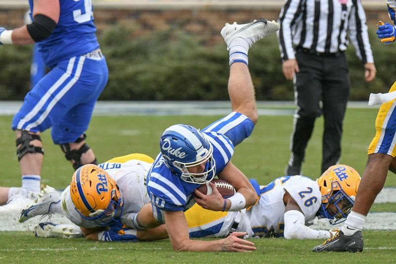 Nov 6, 2021; Durham, North Carolina, USA;  Duke Blue Devils quarterback Riley Leonard (10) is tackled on a keeper during the third quarter against the Pittsburgh Panthers at Wallace Wade Stadium. Mandatory Credit: William Howard-USA TODAY Sports