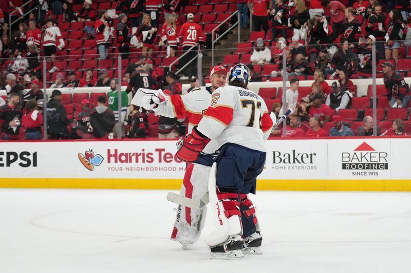 May 22, 2025; Raleigh, North Carolina, USA; Florida Panthers goaltender Vitek Vanecek (41) congratulates goaltender Sergei Bobrovsky (72) for the win against the Carolina Hurricanes in game two of the Eastern Conference Final of the 2025 Stanley Cup Playoffs at Lenovo Center. Mandatory Credit: James Guillory-Imagn Images