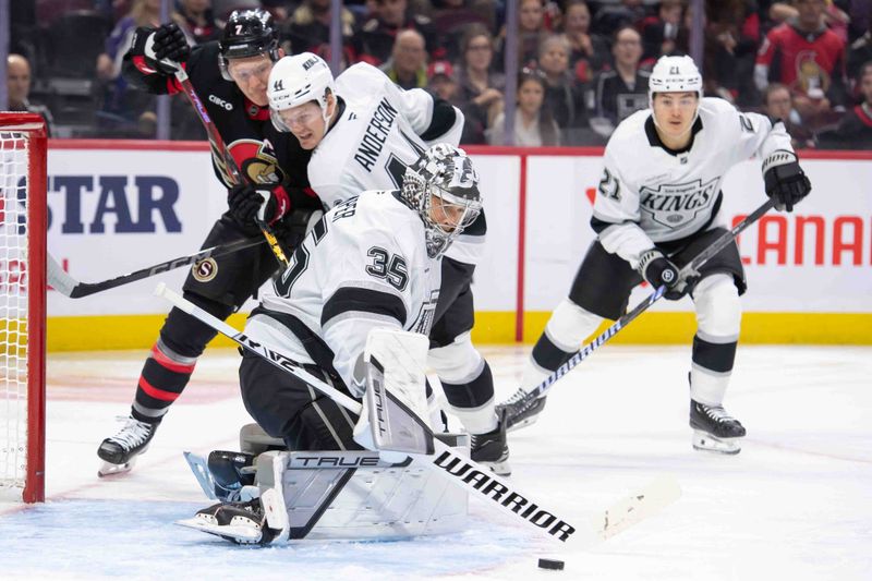 Oct 14, 2024; Ottawa, Ontario, CAN; Los Angeles Kings goalie Darcy Kuemper (35) makes a save in front of Ottawa Senators lef wing Brady Tkachuk (7) in the first period at the Canadian Tire Centre. Mandatory Credit: Marc DesRosiers-Imagn Images