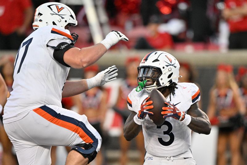 Oct 4, 2025; Louisville, Kentucky, USA; Virginia Cavaliers running back J'Mari Taylor (3) celebrates a touchdown with offensive lineman Noah Josey (77) during the overtime against the Louisville Cardinals at L&N Federal Credit Union Stadium. Virginia defeated Louisville 30-27. Mandatory Credit: Jamie Rhodes-Imagn Images