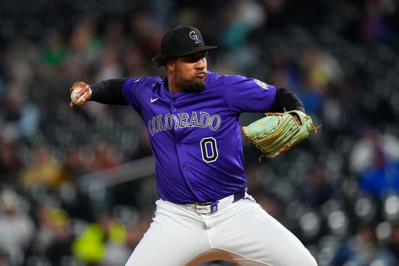 Sep 17, 2025; Denver, Colorado, USA; Colorado Rockies relief pitcher Jaden Hill (0) delivers a pitch in the sixth inning against the Miami Marlins at Coors Field. Mandatory Credit: Ron Chenoy-Imagn Images