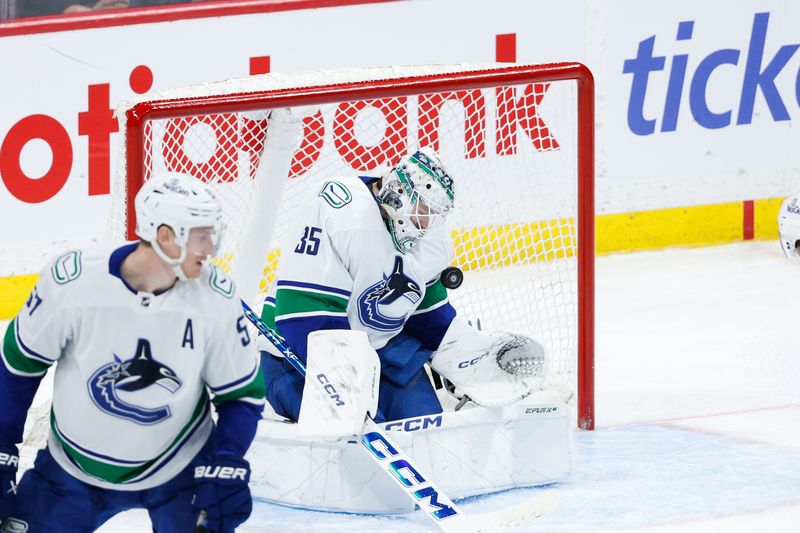 Apr 18, 2024; Winnipeg, Manitoba, CAN;  Vancouver Canucks goalie Thatcher Demko (35) makes a save against the Winnipeg Jets during the third period at Canada Life Centre. Mandatory Credit: Terrence Lee-USA TODAY Sports