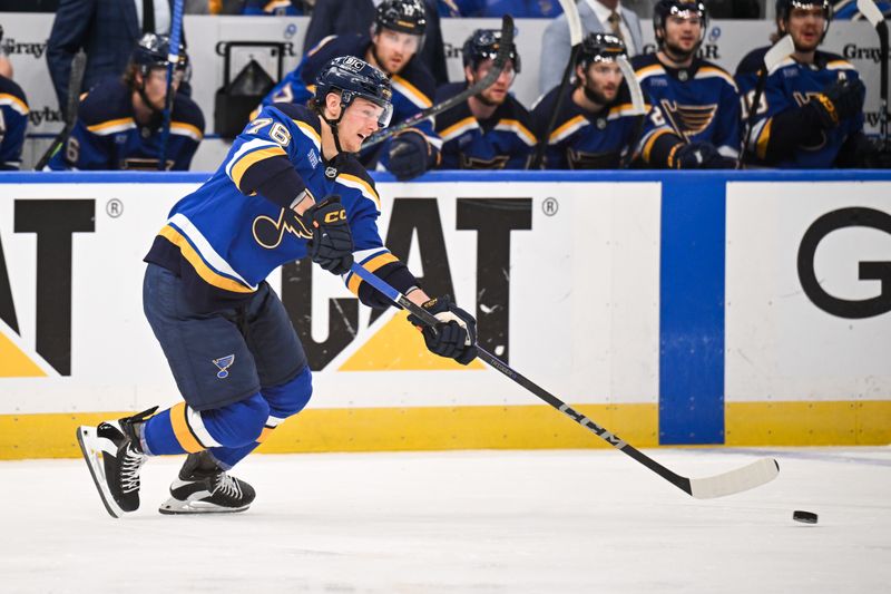 May 2, 2025; St. Louis, Missouri, USA; St. Louis Blues right wing Zack Bolduc (76) passes the puck against the Winnipeg Jets during the first period in game six of the first round of the 2025 Stanley Cup Playoffs at Enterprise Center. Mandatory Credit: Connor Hamilton-Imagn Images