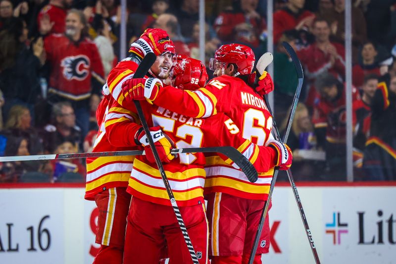 Apr 18, 2024; Calgary, Alberta, CAN; Calgary Flames right wing Adam Klapka (43) celebrates his goal with teammates against the San Jose Sharks during the first period at Scotiabank Saddledome. Mandatory Credit: Sergei Belski-USA TODAY Sports