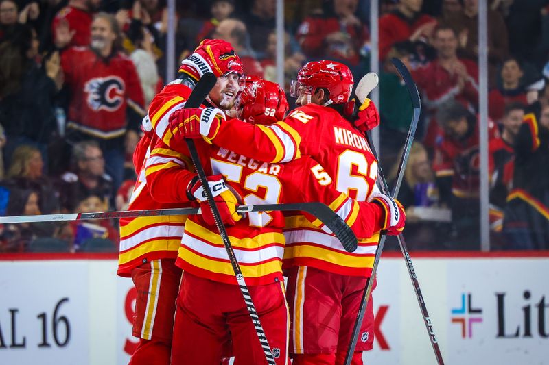 Apr 18, 2024; Calgary, Alberta, CAN; Calgary Flames right wing Adam Klapka (43) celebrates his goal with teammates against the San Jose Sharks during the first period at Scotiabank Saddledome. Mandatory Credit: Sergei Belski-USA TODAY Sports