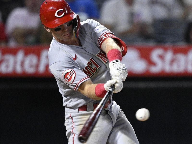 Aug 23, 2023; Anaheim, California, USA; Cincinnati Reds second baseman Matt McLain (9) hits a two-run home run against the Los Angeles Angels during the eighth inning at Angel Stadium. Mandatory Credit: Orlando Ramirez-USA TODAY Sports