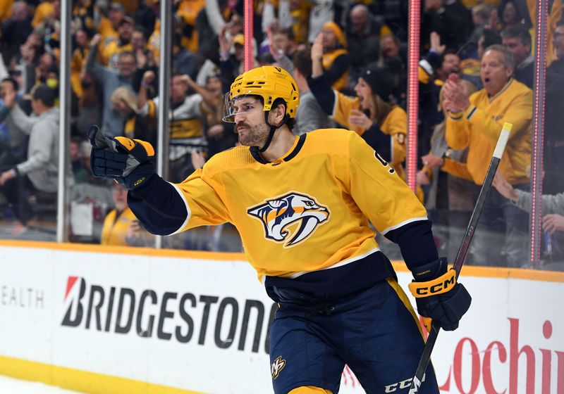 Jan 26, 2023; Nashville, Tennessee, USA; Nashville Predators left wing Filip Forsberg (9) celebrates after a goal against New Jersey Devils goaltender Mackenzie Blackwood (not pictured) during the third period at Bridgestone Arena. Mandatory Credit: Christopher Hanewinckel-USA TODAY Sports