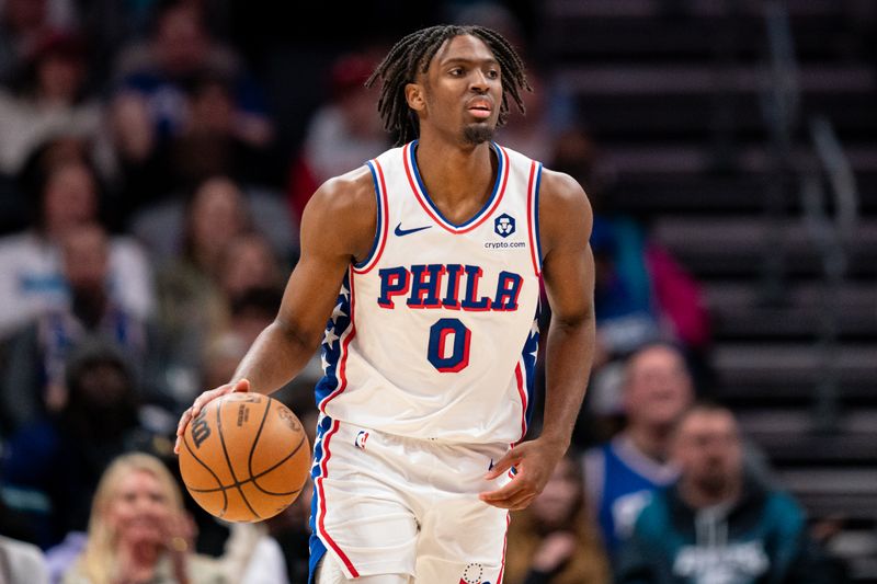 CHARLOTTE, NORTH CAROLINA - JANUARY 20: Tyrese Maxey #0 of the Philadelphia 76ers brings the ball up court against the Charlotte Hornets during their game at Spectrum Center on January 20, 2024 in Charlotte, North Carolina. NOTE TO USER: User expressly acknowledges and agrees that, by downloading and or using this photograph, User is consenting to the terms and conditions of the Getty Images License Agreement. (Photo by Jacob Kupferman/Getty Images)