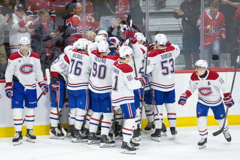 Jan 17, 2026; Ottawa, Ontario, CAN; Montreal Canadiens right wing Cole Caufield (13) celebrates with teammates after scoring the game winning overtime goal against the Ottawa Senators at the Canadian Tire Centre. Mandatory Credit: Marc DesRosiers-IMAGN Images