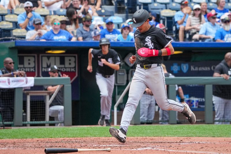 Jul 21, 2024; Kansas City, Missouri, USA; Chicago White Sox shortstop Nicky Lopez (8) scores a run against the Kansas City Royals in the fifth inning  at Kauffman Stadium. Mandatory Credit: Denny Medley-USA TODAY Sports