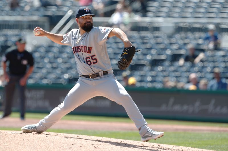 Apr 12, 2023; Pittsburgh, Pennsylvania, USA;  Houston Astros starting pitcher Jose Urquidy (65) delivers a pitch against the Pittsburgh Pirates during the first inning at PNC Park. Mandatory Credit: Charles LeClaire-USA TODAY Sports