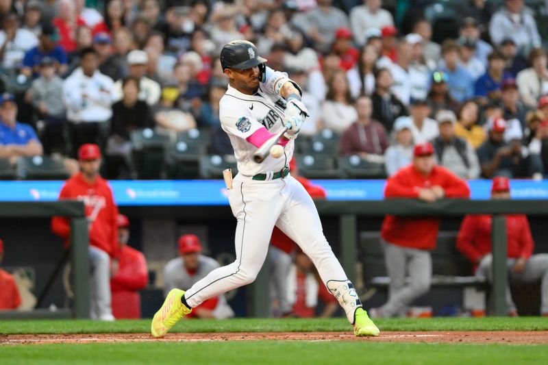 Sep 11, 2023; Seattle, Washington, USA; Seattle Mariners center fielder Julio Rodriguez (44) hits a single against the Los Angeles Angels during the first inning at T-Mobile Park. Mandatory Credit: Steven Bisig-USA TODAY Sports