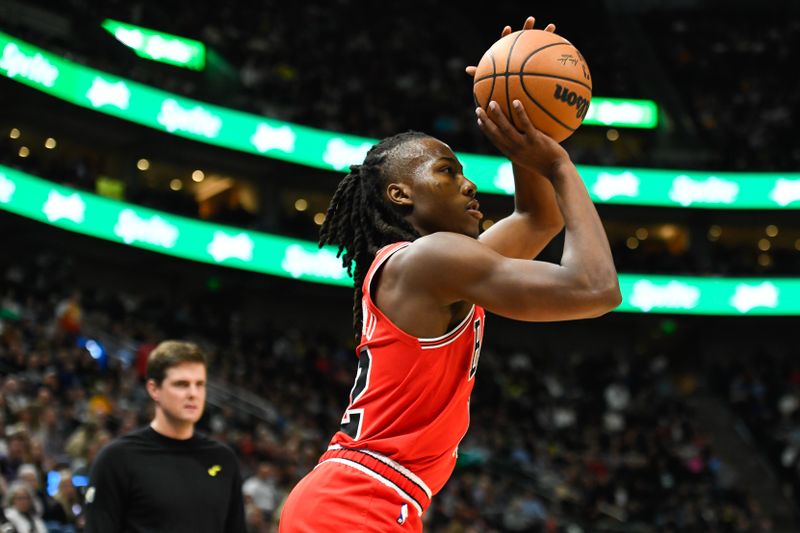 SALT LAKE CITY, UTAH - MARCH 06: Ayo Dosunmu #12 of the Chicago Bulls shoots during the first half of a game against the Utah Jazz at Delta Center on March 06, 2024 in Salt Lake City, Utah. NOTE TO USER: User expressly acknowledges and agrees that, by downloading and or using this photograph, User is consenting to the terms and conditions of the Getty Images License Agreement.  (Photo by Alex Goodlett/Getty Images)