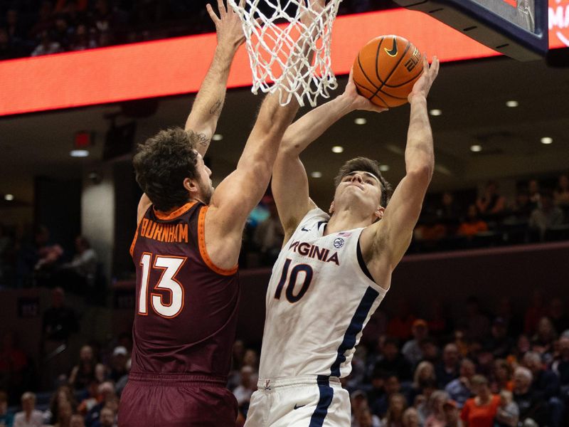 Feb 1, 2025; Charlottesville, Virginia, USA; Virginia Tech Hokies guard Tyler Johnson (10) shoots the ball while Virginia Cavaliers guard Desmond Roberts (13) defends in the first half at John Paul Jones Arena. Mandatory Credit: Emily Morgan-Imagn Images