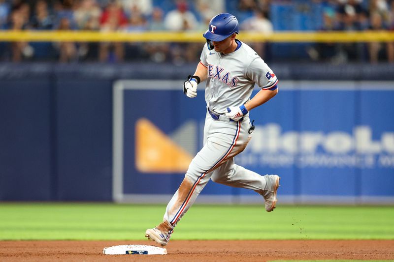 Apr 3, 2024; St. Petersburg, Florida, USA;  Texas Rangers designated hitter Corey Seager (5) runs the bases after hitting a solo home run against the Tampa Bay Rays in the sixth inning at Tropicana Field. Mandatory Credit: Nathan Ray Seebeck-USA TODAY Sports