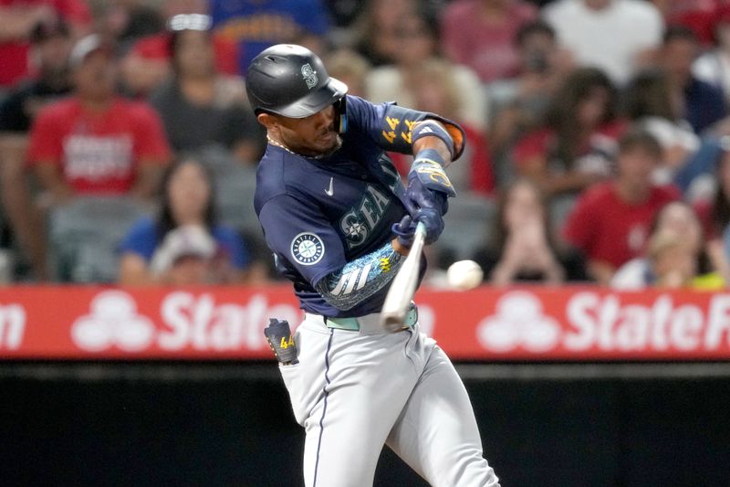 Aug 31, 2024; Anaheim, California, USA; Seattle Mariners center fielder Julio Rodriguez (44) hits a two-run single in the fourth inning against the Los Angeles Angels at Angel Stadium. Mandatory Credit: Kirby Lee-USA TODAY Sports