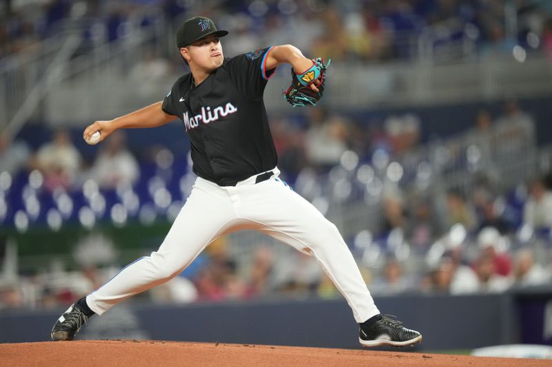 Sep 20, 2024; Miami, Florida, USA;  Miami Marlins pitcher Valente Bellozo (83) pitches against the Atlanta Braves in the first inning at loanDepot Park. Mandatory Credit: Jim Rassol-Imagn Images