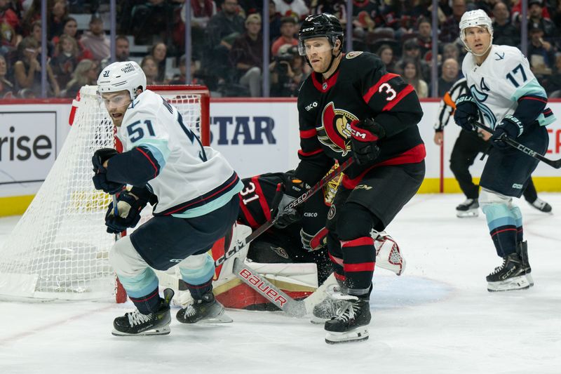 Nov 2, 2024; Ottawa, Ontario, CAN; Seattle Kraken center Shane Wright (51) and Ottawa Senators defenseman Nick Jensen (3) follow the puck in the second period at the Canadian Tire Centre. Mandatory Credit: Marc DesRosiers-Imagn Images