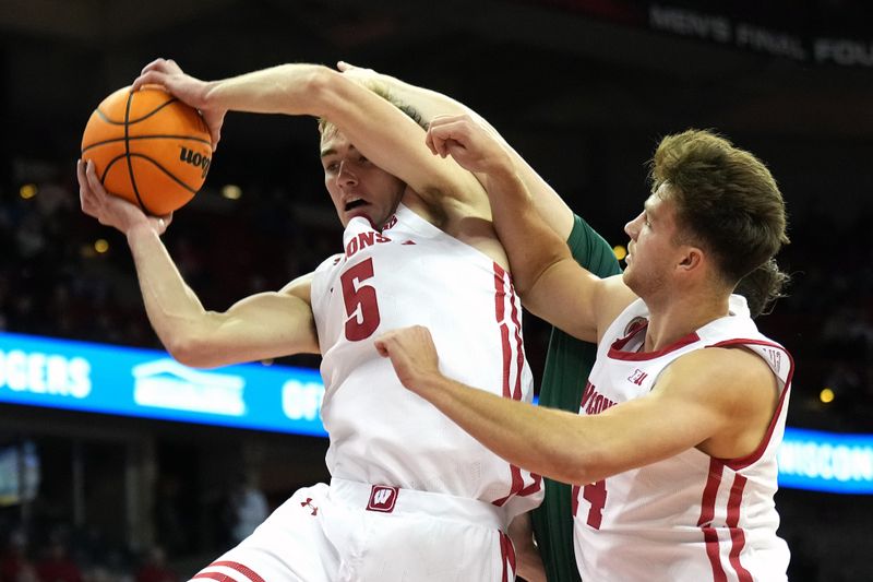 Nov 15, 2022; Madison, Wisconsin, USA; Wisconsin Badgers forward Tyler Wahl (5) rebounds the ball with teammate Carter Gilmore (right) during the first half against the Green Bay Phoenix at the Kohl Center. Mandatory Credit: Kayla Wolf-USA TODAY Sports