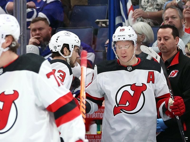 Jan 27, 2024; Tampa, Florida, USA; New Jersey Devils left wing Ondrej Palat (18) is congratulated after he scored a goal against the New Jersey Devils during the third period at Amalie Arena. Mandatory Credit: Kim Klement Neitzel-USA TODAY Sports